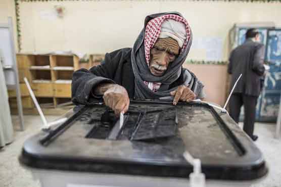 Egyptians vote on disputed constitution