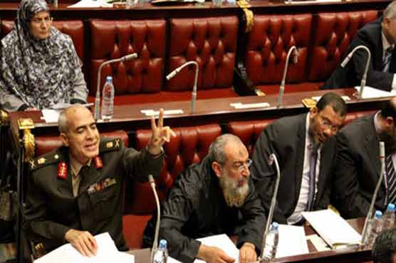 Egypt adopts new constitution as opposition cries foul