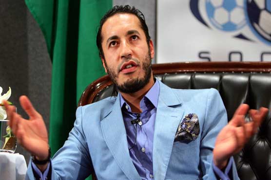 Kadhafis son says he will return to Libya