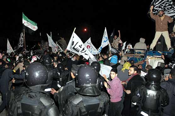 Syria rejects UN charges as Homs under barrage