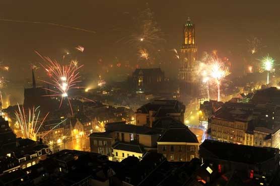 World rings in 2012 with hope for better year