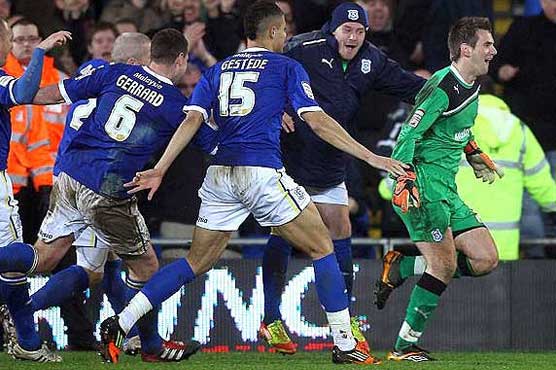 Cardiff through after shoot out win
