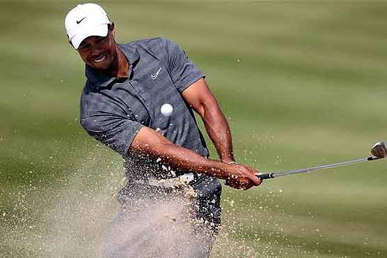 Golf: Rock solid as Woods stumbles