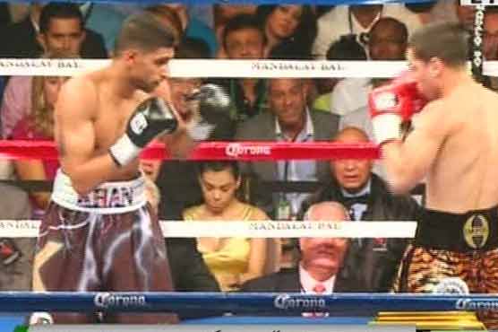 Garcia stuns Khan to claim WBA title 