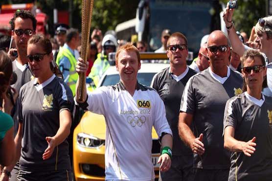  Grint carries Olympic flame