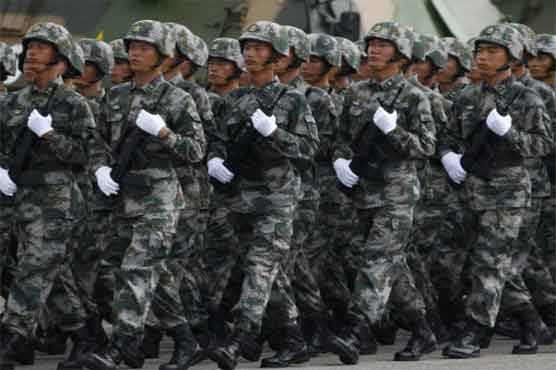 China posts army officers at disputed island 