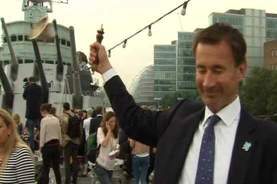 Ministers Olympic bell flies off-handle into crowd 
