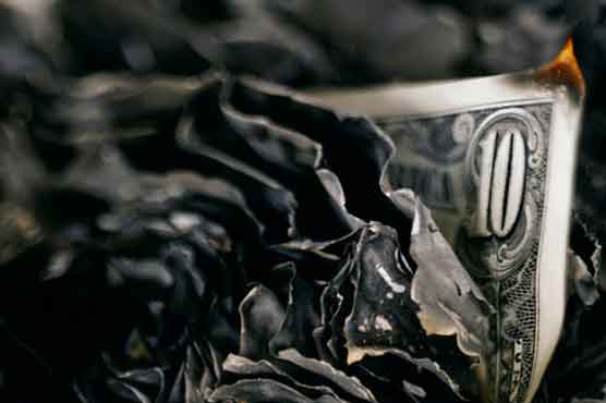 Man hides $15,000 in oven, wife burns it