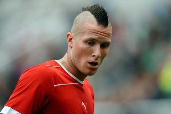 Swiss Olympic team expels player for racist tweet