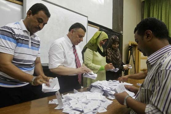 Egypt Brotherhood says Morsy leads early vote count