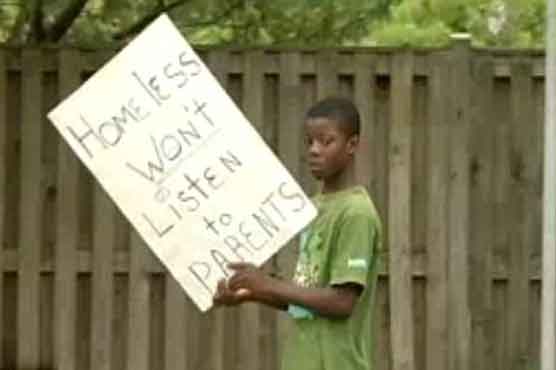 Boy carries 'homeless' sign as punishment