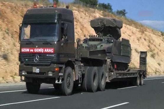 Turkey fortifies Syrian border; bomb hits Damascus