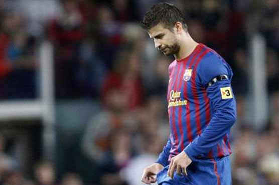 Barca's Pique could face ban for referee criticism