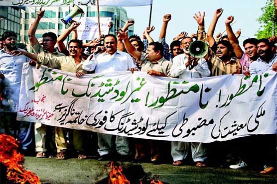 Traders protest against raise in petrol, power prices