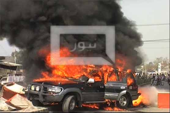 Man sets household goods on fire in protest