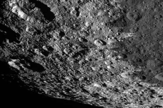 Spacecraft glimpses new views of moon Rhea