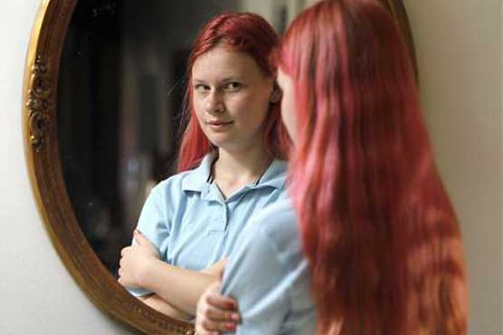 Pink-haired student can go back to school 