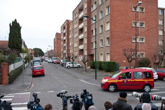 French police tighten siege on Al Qaeda gunman
