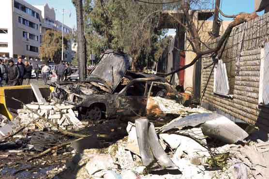 Dozens of people killed in twin blasts in Damascus