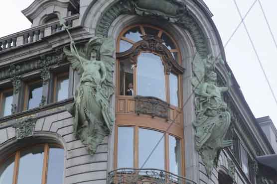 Tycoon throws out paper planes made of money