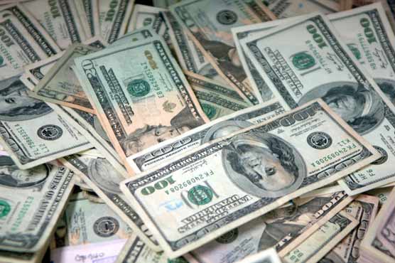 Dollar rises in Asia on Greek woes, Japan outlook