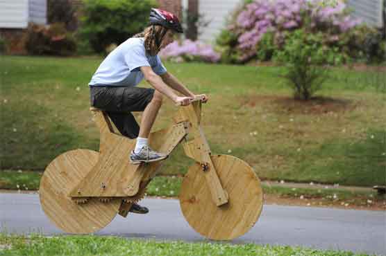 Teenager builds wooden bicycle 