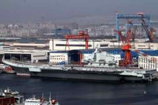 China conducts first landing on aircraft carrier