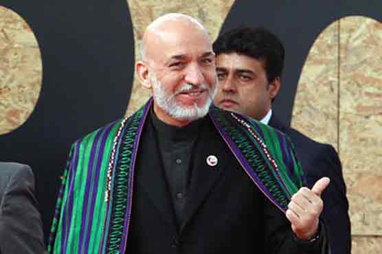 Karzai pledges new Afghan president in 2014