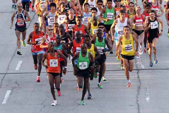 Kebede wins Chicago Marathon in course record