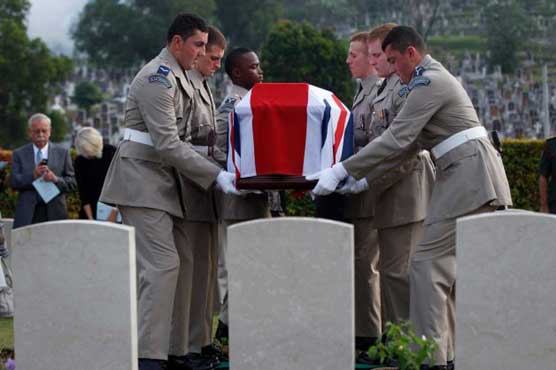 8 British airmen buried in Malaysia after 67 years