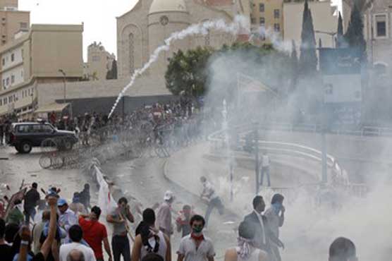 Lebanon police tear-gas anti-PM protest at funeral