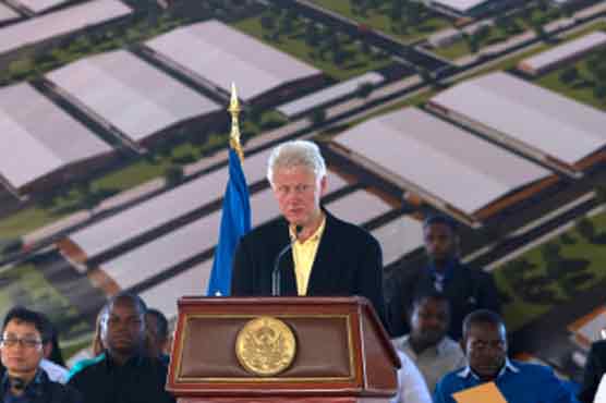 Clintons land in Haiti to showcase industrial park