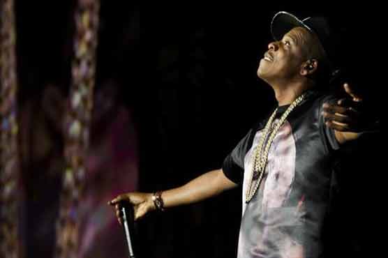 Kanye backs Jay-Z at festival; Obama in video 