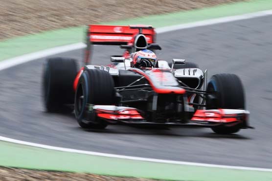 Button keeps cool to win crash-marred Belgian GP