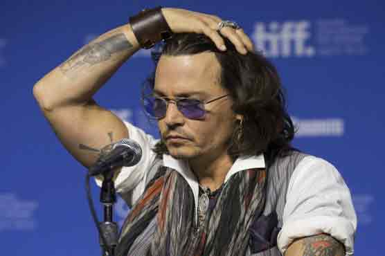 Johnny Depp shares 'ink' with Damien Echols 