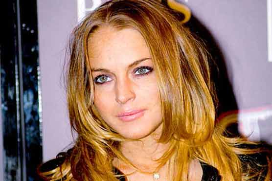 Lohan charged with leaving accident spot
