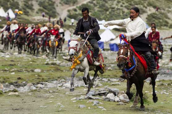 Buddhists battle in worlds highest horse race