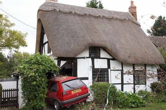 Car crashes through chocolate box cottage 