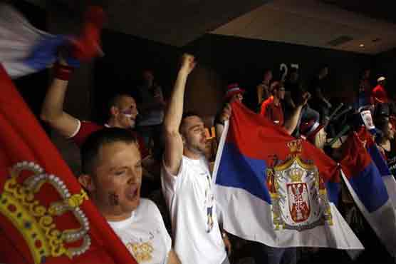 Serbia leads US 2-1 after marathon doubles