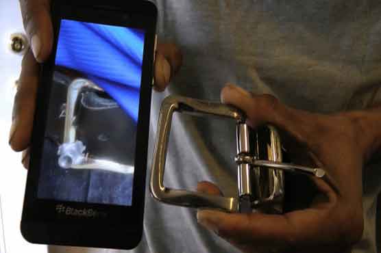 Bullet hits Philadelphia shop worker's belt buckle