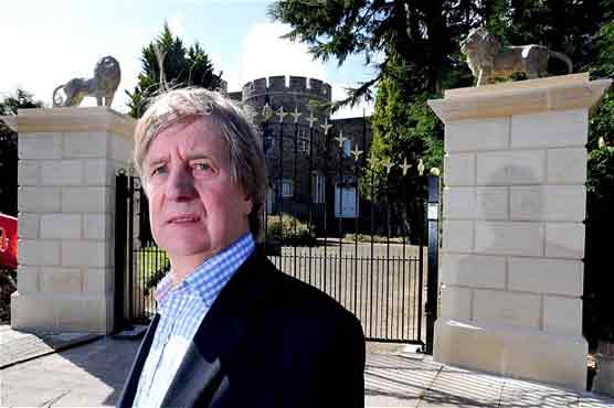 Property developer ordered to remove lion gate-posts from castle 