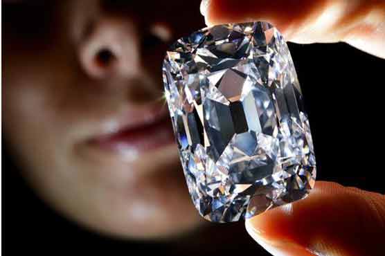 Woman, 80, swallows diamond at charity event