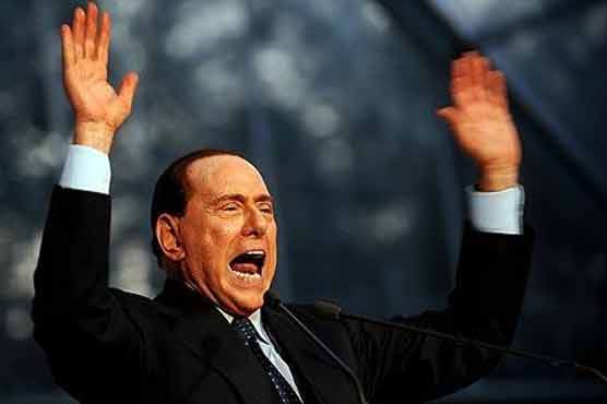 Berlusconi tells cheering crowd he is innocent 
