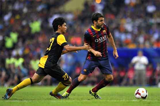 Fabregas injures right ankle, out of Spain squad