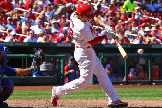 Cardinals edge Pirates in 14 to slice lead 