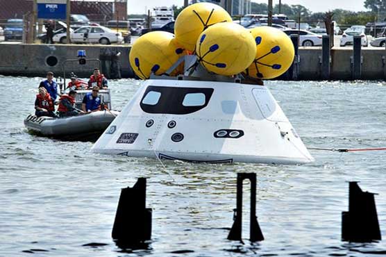 NASA, Navy practice space-capsule recovery