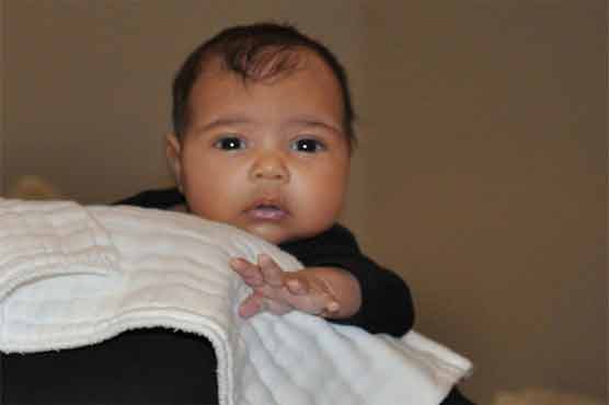 Kanye West unveils photo of baby on TV's 'Kris'