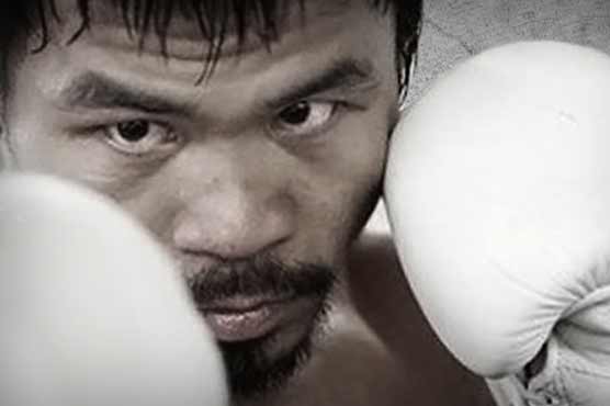 Philippine boxing hero Pacquiao hands money, Bibles to Haiyan survivors