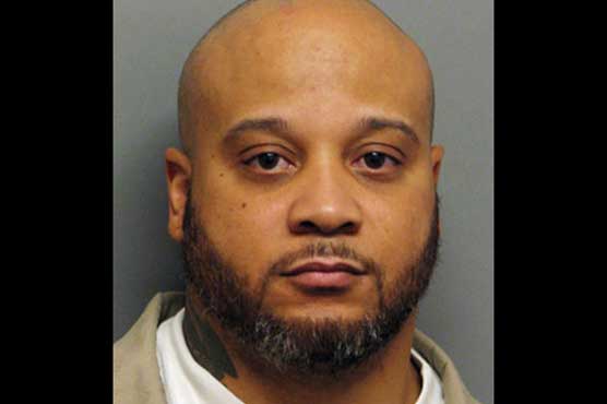 Mistakenly freed killer captured while watching TV