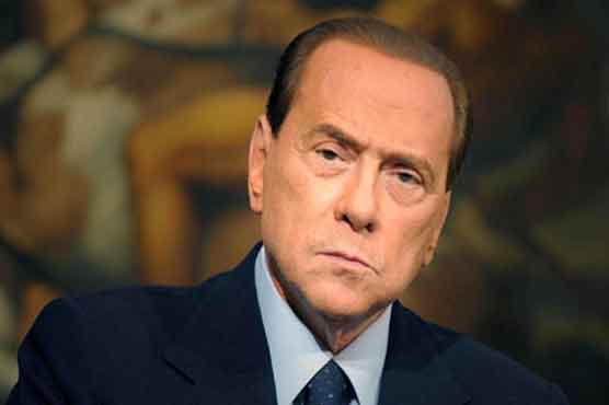 Berlusconi vows to defend race abuse victim